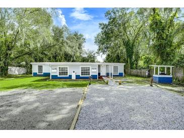 Cute blue house with a spacious yard at 313 Story Partin Rd, Orlando, FL 32833