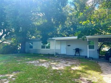 Ranch style home with a large yard and driveway at 1025 Susan St, Leesburg, FL 34748