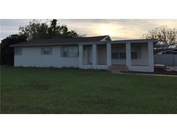 A simple, ranch-style home with a covered porch at 1106 N Hoagland Blvd, Kissimmee, FL 34741