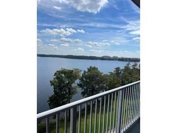 Breathtaking view of the lake from a private balcony at 13427 Blue Heron Beach Dr # 501, Orlando, FL 32821