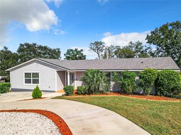 Newly renovated home with a landscaped yard at 2281 E Union Cir, Deltona, FL 32725