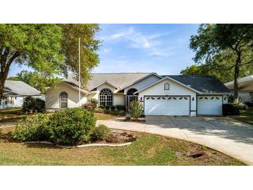 Single-Gathering home with a two-car garage and landscaping at 2717 Bayview Dr, Eustis, FL 32726