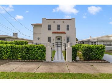 Two-story home with a walkway and manicured hedges at 424 Pelican Ave, Daytona Beach, FL 32118