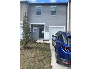 Two-story townhome exterior at 153 Mandovi St, Davenport, FL 33837