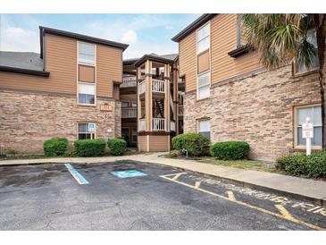 Three-story building with brick and wood siding at 494 N Pin Oak Pl # 308, Longwood, FL 32779