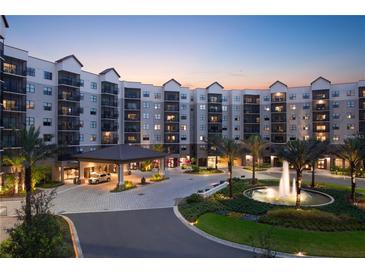 Luxury apartment building with fountain and ample parking at 14501 Grove Resort Ave # 1507, Winter Garden, FL 34787