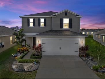 Two-story house with landscaped front yard at 1008 Overlook Ct, Davenport, FL 33837