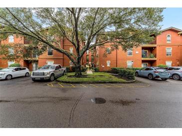 Attractive red brick building with ample parking and landscaping at 132 Vista Verdi Cir # 220, Lake Mary, FL 32746