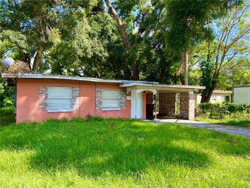 Front view of a single story house with a yard at 1011 Columbia St, Orlando, FL 32805