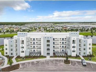 Aerial view of a modern apartment building at 3161 Paradox Cir # 101, Kissimmee, FL 34746