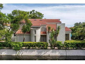 Mediterranean-style home with tile roof, nestled by a canal at 1000 Winderley Pl # 7, Maitland, FL 32751