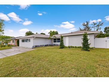 Contemporary house with a grassy lawn, showcasing curb appeal at 1925 Blossom Ln, Maitland, FL 32751