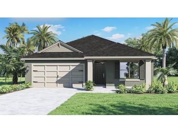 Single-story home with a two-car garage and landscaped yard at 2622 Sage Valley Way, Winter Haven, FL 33884