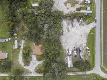 Aerial view of a property with ample space and buildings at 621 Oaklando Dr, Altamonte Springs, FL 32714