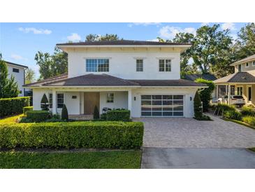 Stunning two-story home with modern design and landscaping at 830 Oakdale St, Windermere, FL 34786