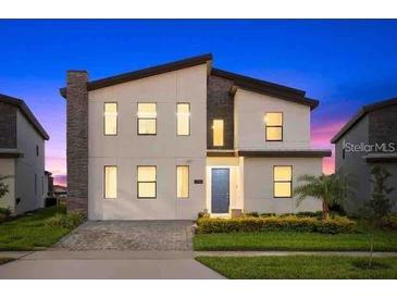 Stunning two-story home with modern design and landscaping at 4535 Narrative Ln, Kissimmee, FL 34746