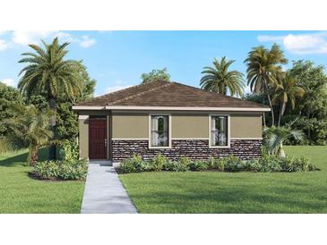 One-story home with stone accents and a welcoming front porch at 1584 Hummingbird Rd, Winter Haven, FL 33884
