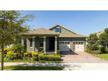 Beautiful two-story home with a two-car garage and landscaped yard at 10386 Atwater Bay Dr, Winter Garden, FL 34787