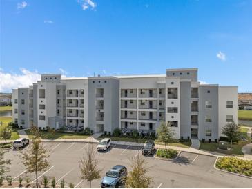Modern apartment building with ample parking at 3131 Paradox Circle 204 # 204, Kissimmee, FL 34746