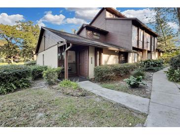 Inviting exterior of townhome with landscaped walkway at 1017 Love Ln # 34, Apopka, FL 32703