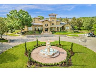 Community center with fountain and lush landscaping at 185 Villa Di Este Ter # 201, Lake Mary, FL 32746