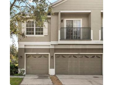 Townhouse exterior with two car garage at 2020 Estancia Cir # A, Kissimmee, FL 34741