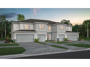 Three-car garage home with light gray siding at 2511 Bright Jewel St, Kissimmee, FL 34746