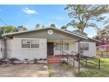 Brick house with gray trim and carport at 447-441 N Lincoln St, Daytona Beach, FL 32114