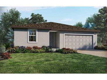 One-story home with gray siding, brown roof, and attached garage at 4953 Kaia Ave, Winter Haven, FL 33884