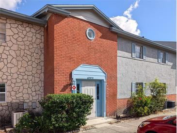 Brick and stone exterior of a two-story building with a light blue door at 3053 George Mason Ave # D, Winter Park, FL 32792