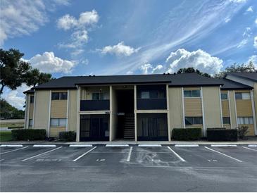 Two-story condo building with parking and landscaping at 902 Lake Destiny Rd # A, Altamonte Springs, FL 32714