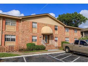 Brick building exterior with entrance and parking at 404 Banyon Tree Cir # 200, Maitland, FL 32751