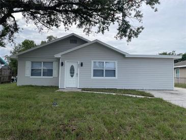 Newly renovated light gray house with a white front door at 603 Maggie Cir, Winter Haven, FL 33880