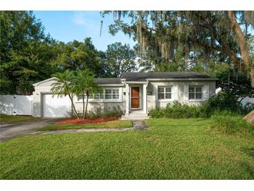 Charming bungalow with a well-manicured lawn and mature trees at 1135 Golfview St, Orlando, FL 32804