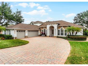 Beautiful home with three-car garage and paver driveway at 1869 Merlot Dr, Sanford, FL 32771