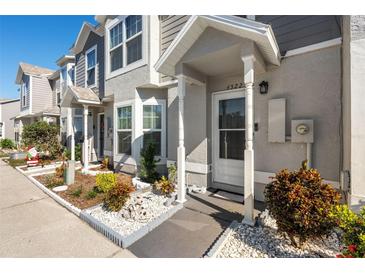 Townhome entrance with landscaping and walkway at 4522 Brook Hollow Cir, Winter Springs, FL 32708