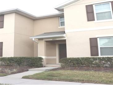 Two-story townhome with front door and landscaping at 4803 Apple Blossom Ln # 4803, Saint Cloud, FL 34771