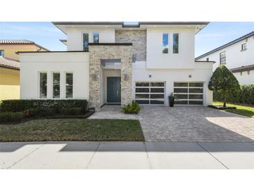 Modern two-story house with stone accents at 1429 Chapman Cir, Winter Park, FL 32789