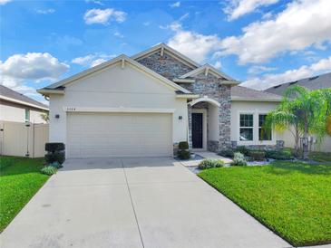 Beautiful two-story house with stone accents at 5364 Ragusa Loop, Saint Cloud, FL 34771