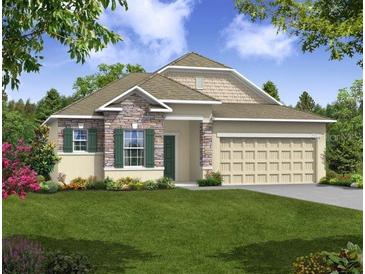 Two-story house with stone and shingle accents at 108 Burlington Pl, Poinciana, FL 34758