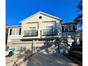 Two-story townhome with attached garage and balconies at 6430 S Goldenrod Rd # 15B, Orlando, FL 32822