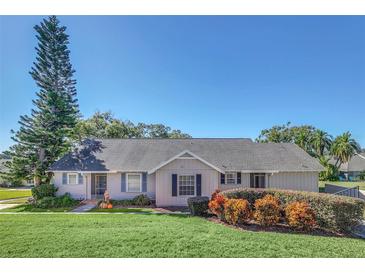 Single-story home with a well-manicured lawn and landscaping at 1084 Villa Ln # 72, Apopka, FL 32712