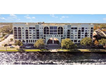 Aerial view of a waterfront building with parking and city views at 225 W Seminole Blvd # 206, Sanford, FL 32771