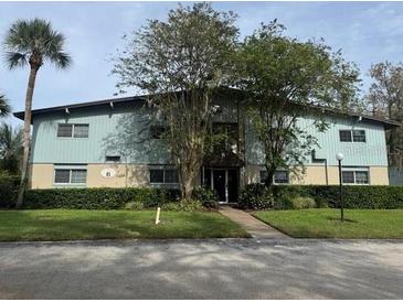 Building exterior showcasing a well-maintained property with landscaping at 1695 Lee Rd # B216, Winter Park, FL 32789