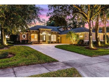 Beautiful home exterior at dusk with landscaping at 2781 Tree Meadow Loop, Apopka, FL 32712