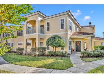 Two-story townhome with inviting front porch and landscaped lawn at 1812 Arbor Lakes Cir # 1812, Sanford, FL 32771