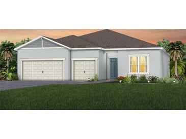 Single-story home with a two-car garage and attractive landscaping at 1623 Green Orchard St, St Cloud, FL 34771