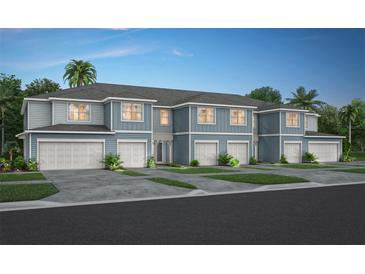 Three-unit townhome building with attached garages and neutral color scheme at 3328 Pondside Way, Sanford, FL 32773