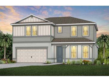 Two-story house with gray siding, white garage door, and landscaping at 6018 Forest Perch Dr, St Cloud, FL 34771