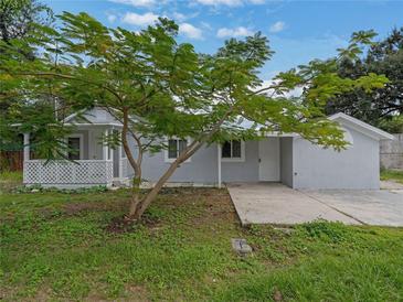 Newly renovated home with front porch and spacious yard at 105 Dudley St, Orlando, FL 32805